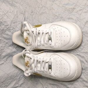 Nike Air Force 1 '07 SE "Next Nature" in the Summit White/Bronzine colorway.